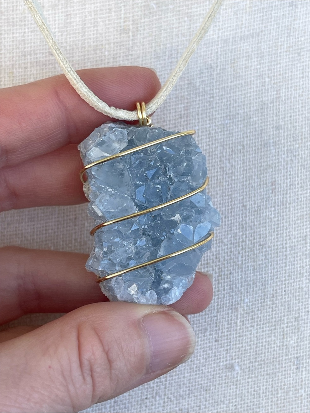 Blue Celestite Druzy Pendant Necklace with Gold Wire Wrap on White Suede Cord